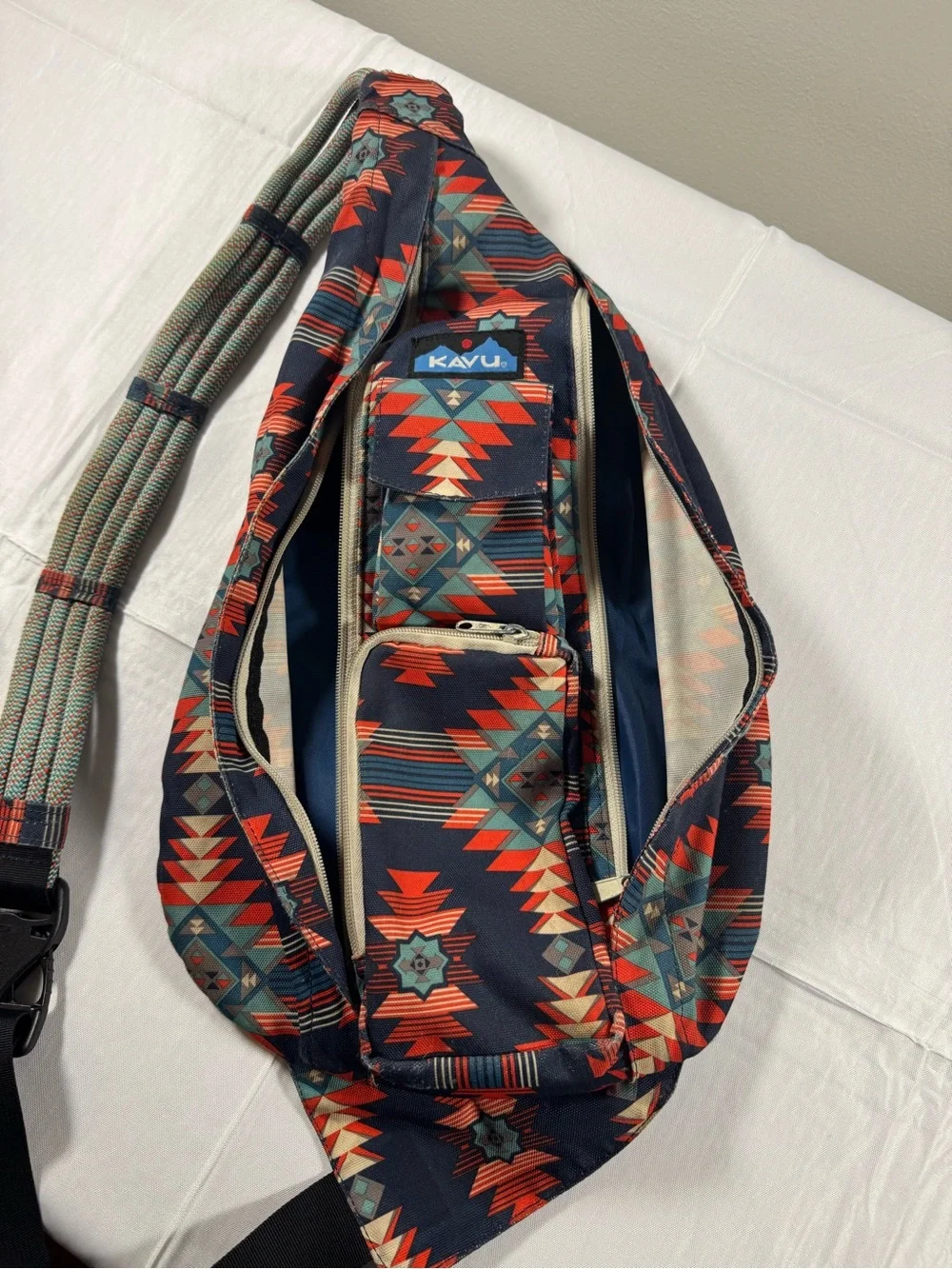 Kavu Rope Sling Bag in Navy with Red & Teal Pattern